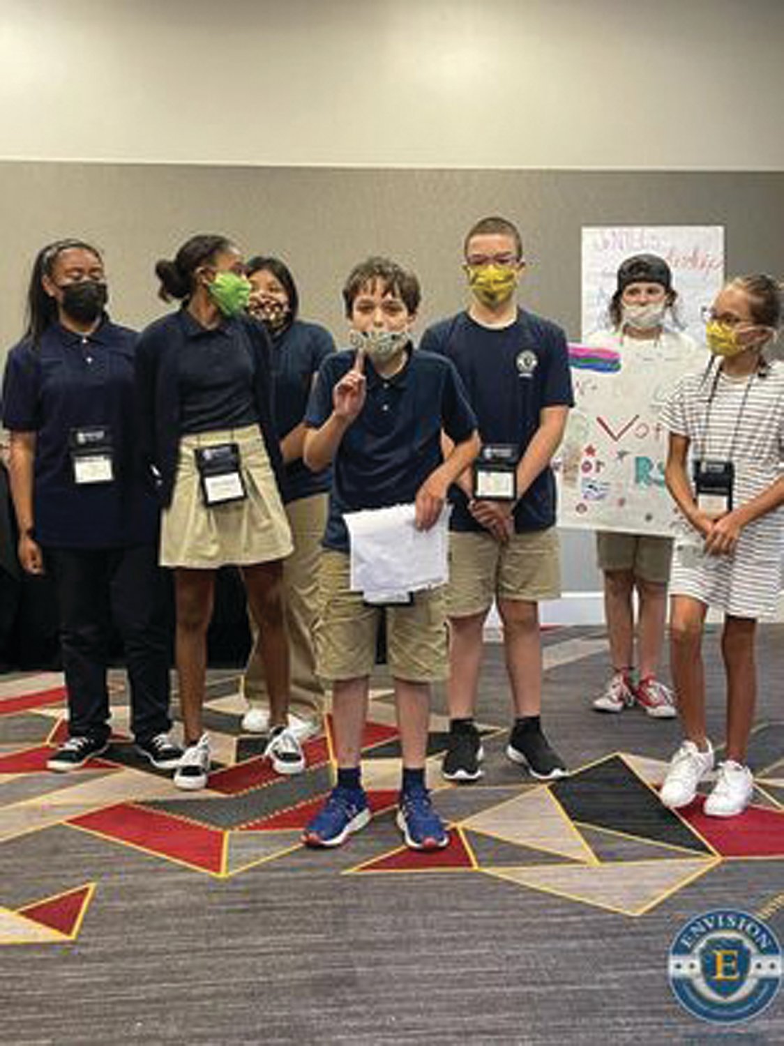 LADIES AND GENTLEMEN, YOUR NEXT PRESIDENT: Ryan Golditch and his campaign team work on getting him elected president at the Envision Junior National Young Leaders Conference in July.